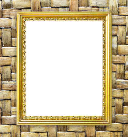 blank golden frame on bamboo texture backgroundの写真素材