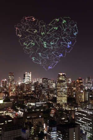 heart sparkle Fireworks celebrating over Tokyo cityscape at night, Japanの写真素材