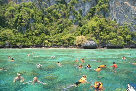 Krabi,Thailand-March 16,2015:Tourists enjoy with snorkeling in a tropical sea at Phi Phi island in Krabi, Thailandのeditorial素材