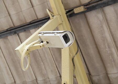 Security Camera or CCTV with roof background
