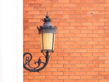 vintage lamp wall with brick wall backgroundの写真素材