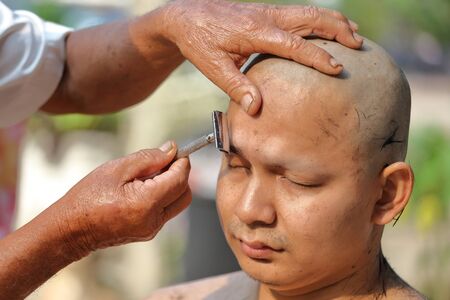 Male who will be monk shaving hair for be Ordained to new monkの写真素材