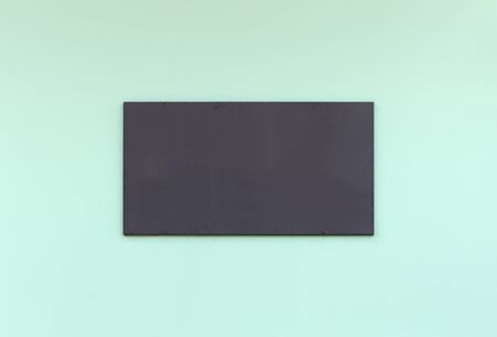 black blank sign on cement wall backgroundの写真素材