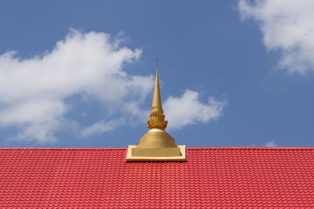 Thai temple roof with small buddhist pagodaの写真素材