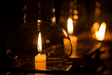 candle in glass lantern at the night