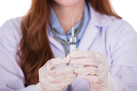 close up of syringe with doctor isolated on white backgroundの写真素材