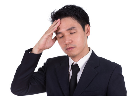business man having stress or a headache isolated on white backgroundの写真素材