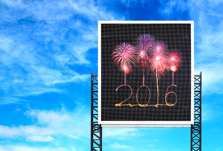 2016 Happy new year firework on large sign board with blue sky background