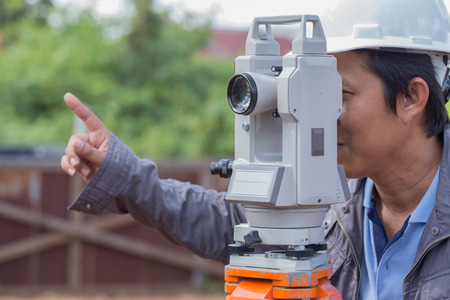 Engineers use tacheometer or theodolite for survey line columns for the construction of buildingsのeditorial素材