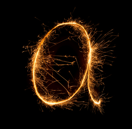 Sparkler firework light alphabet a (Small Letters) at night backgroundの写真素材