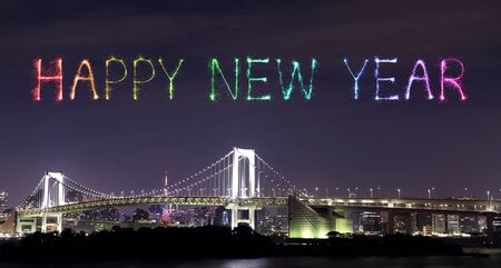 Happy New Year Fireworks celebrating over Tokyo Rainbow Bridge at Night, Odaiba, Japan