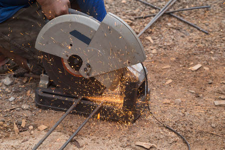 Cutting metal with grinder. Sparks while grinding iron