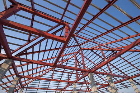 structural steel beam on roof of building residential construction with skyの写真素材