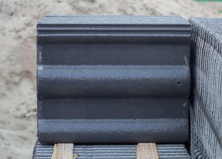 stack of new concrete roof tile (gray color) at construction siteの写真素材