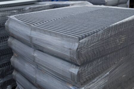 stack of new concrete roof tile (gray color) at construction siteの写真素材