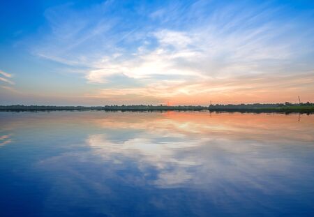 Huayyang reservoir at sunset in summer with with water reflection, Nakhon Ratchasima, Thailandの写真素材