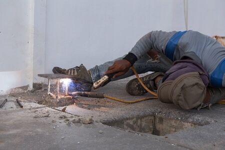 Welder working a welding metal. Not wearing glove