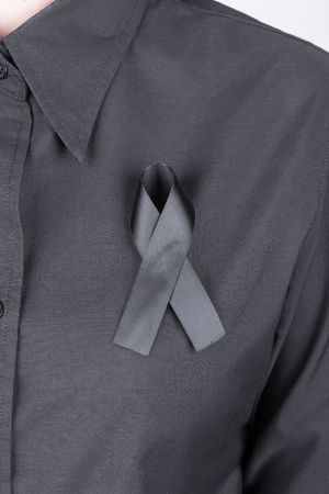 black shirt with black ribbons as a sign of mourningの写真素材
