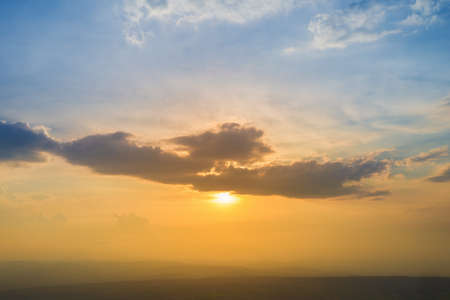 beautiful sunset and cloud with mountainの写真素材