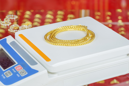 digital scales for weighing gold necklace in storeの写真素材