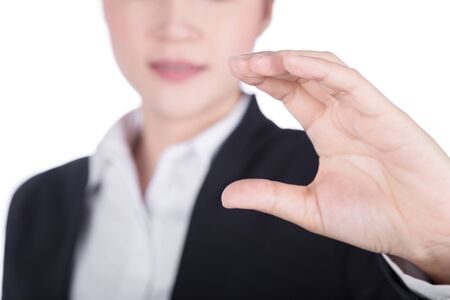 business woman hand holding something isolated on white backgroundの写真素材