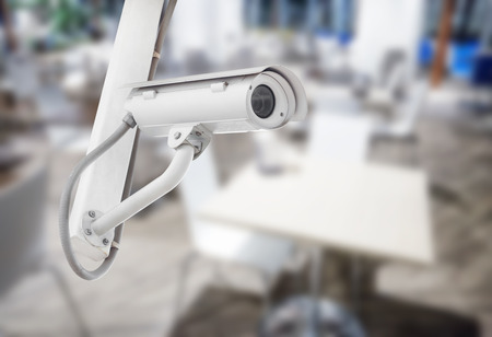 CCTV security camera with blurred restaurant background