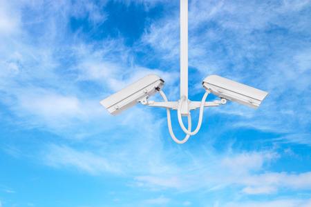 cctv camera with blue sky backgroundの写真素材