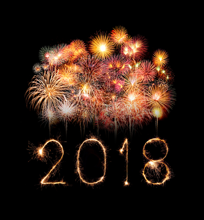 Happy new year 2018 written with Sparkle firework at night Happy new year 2018 written with Sparkle firework at night