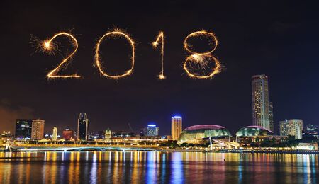 2018 Happy new year firework Sparkle with cityscape of Singapore city at nightの写真素材