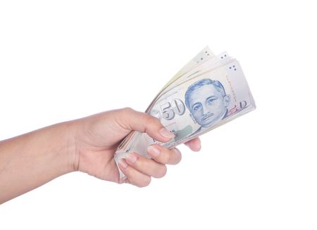 hand with Singapore banknotes dollars (50 SGD) isolated on a white backgroundのeditorial素材