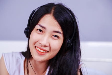 beautiful woman in headphones listening to musicの写真素材