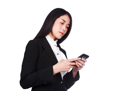 young business woman using a mobile phone isolated on white backgroundの写真素材