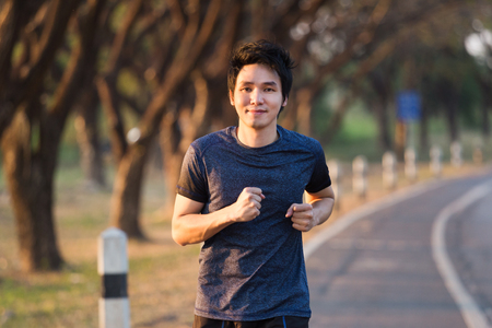 fitness man running in the parkの写真素材