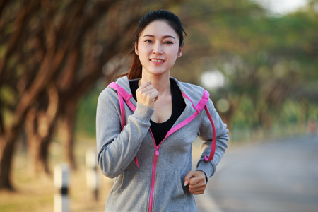 fitness woman running in the parkの写真素材