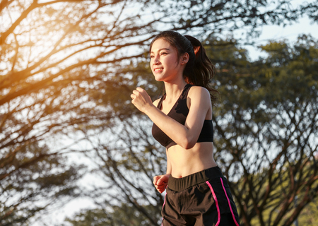 fitness woman running in the parkの写真素材