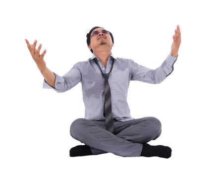stressed businessman with arms raised isolated on white backgroundの写真素材