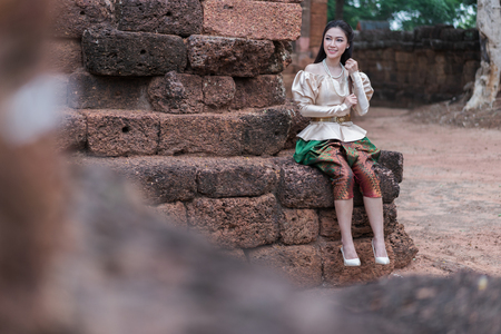 happy beautiful woman in Thai traditional dress の写真素材