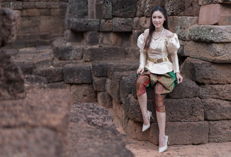 happy beautiful woman in Thai traditional dress の写真素材