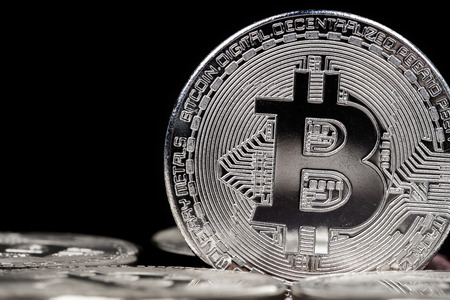 Cryptocurrency physical silver bitcoin on black backgroundの写真素材