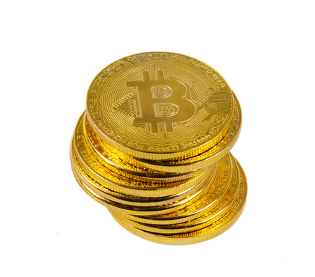 stack of gold bitcoin isolated on a white backgroundの写真素材