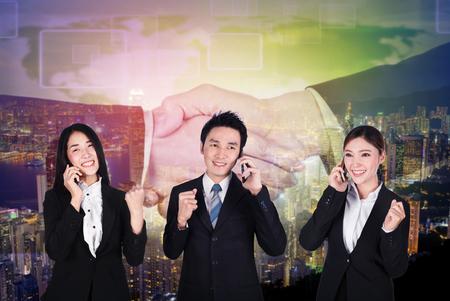 success business man and woman talking on a smartphoneの写真素材