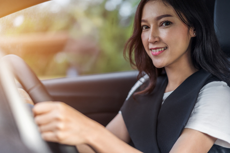 young woman driving in a carの写真素材