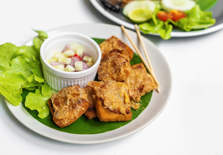 Fried Bread with Minced Pork Spread on plateの写真素材