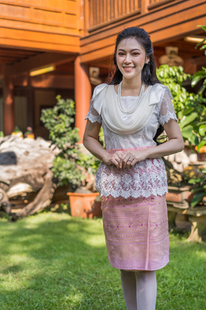 portrait of beautiful young woman in Thai traditional dressの写真素材