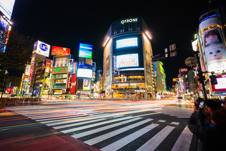 TOKYO , JAPAN - March 25, 2019: The light trails on the  Shibuya famous crossing street at night in Tokyo, Japanのeditorial素材