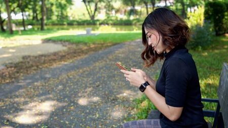 woman using smartphone in the park