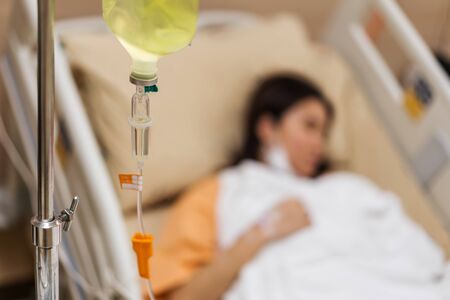 Close up of a saline with woman patient in hospitalの写真素材