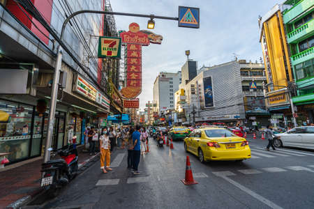 BANGKOK, THAILAND - AUG 9, 2020 : Crowded of people at Yaowarat road after COVID-19 virus pandemic. people must be wearing medical mask in Bangkok's Chinatown.のeditorial素材