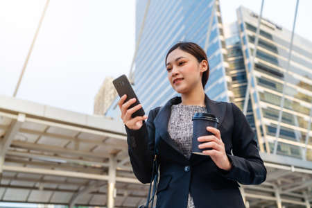 business woman using smartphone in the cityの写真素材