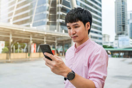 man using smartphone in the cityの写真素材